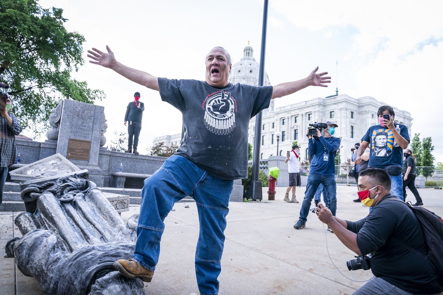 Mike Forcia, of the Black River Anishinabe, celebrated after the Christopher Columbus statue was toppled.