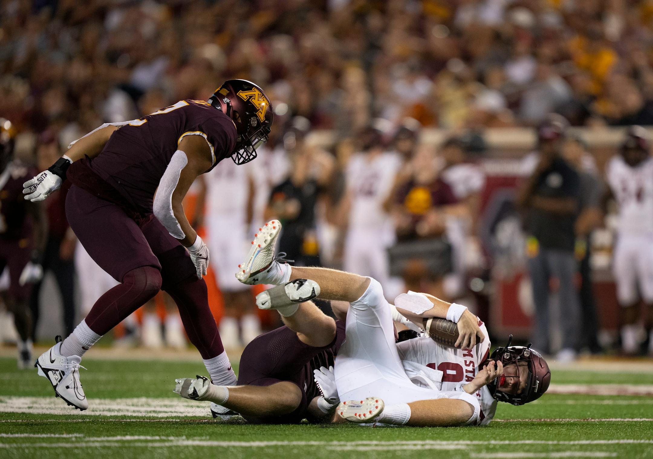 Minnesota Golden Gophers defensive lineman Thomas Rush (8) sacked New Mexico State Aggies quarterback Gavin Frakes (9) for a third quarter loss.