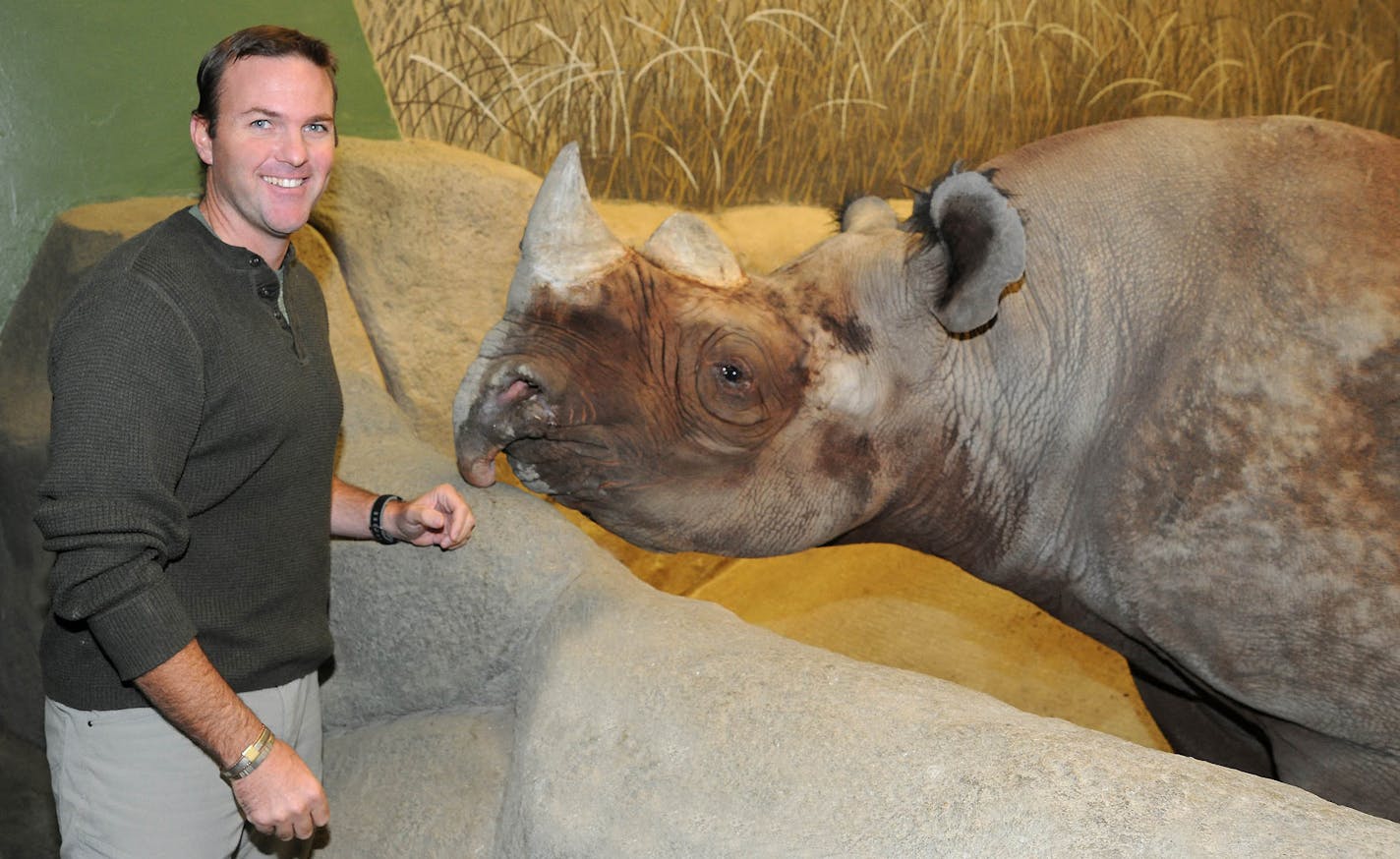 Jeff Muntifering stands by Nakili, a male black rhinoceros living at the Brookfield Zoo located near Chicago.