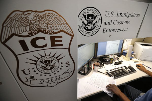 An unidentified Immigration and Customs Enforcement deportation officer reviews forms on April 26, 2017, at the the Pacific Enforcement Response Cente