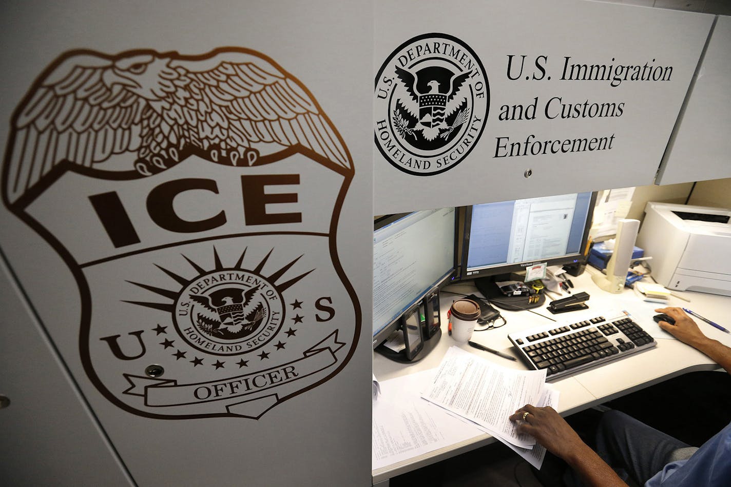 An unidentified Immigration and Customs Enforcement deportation officer reviews forms on April 26, 2017, at the the Pacific Enforcement Response Center in Laguna Niguel, Calif. (Allen J. Schaben/Los Angeles Times/TNS) ORG XMIT: 1357055