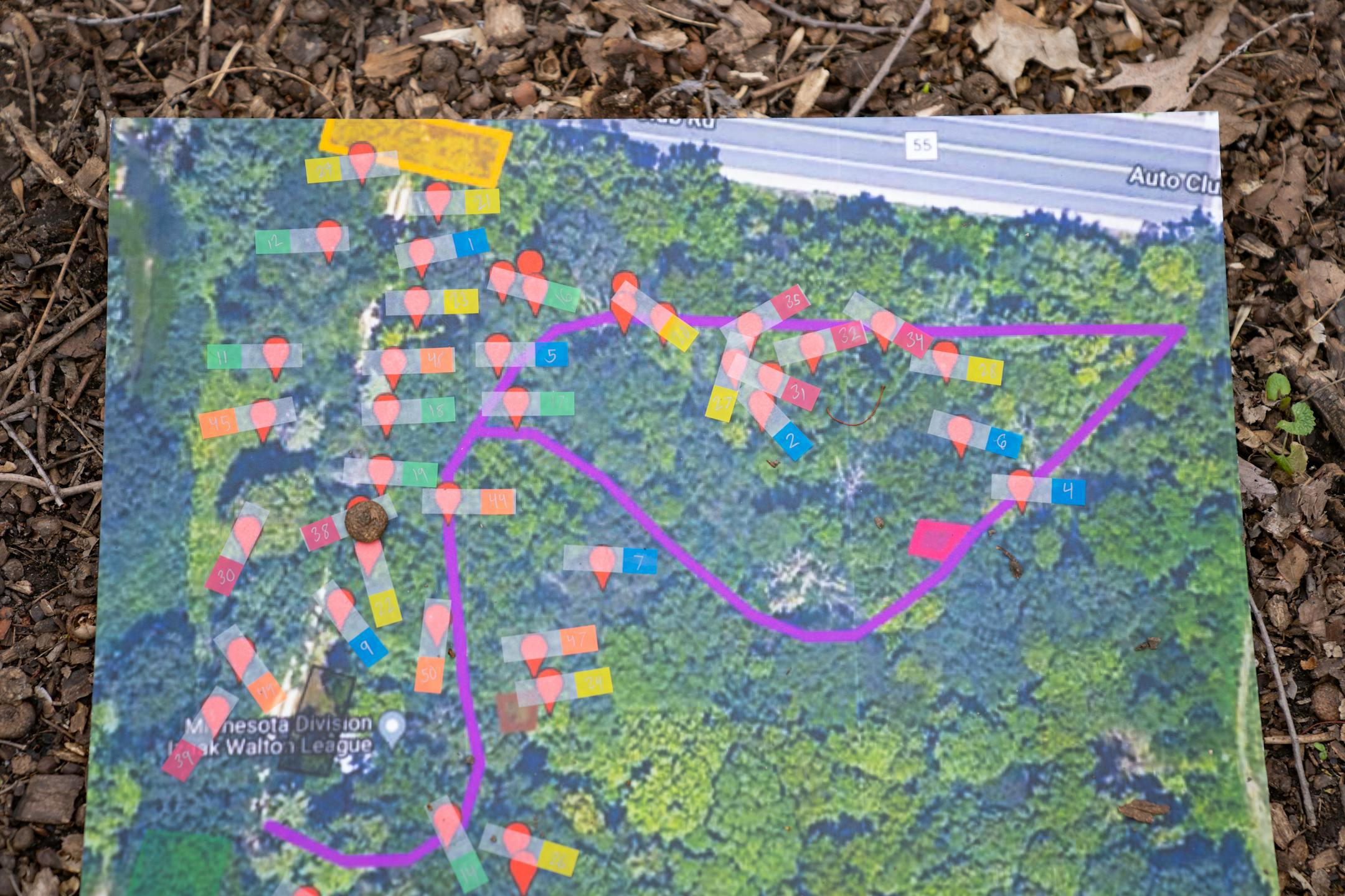 A map marks the locations where oak and elm trees will be planted as part of a tree planting event on Saturday, April 22, 2023, on a Nature Hiking Trail leading to the Minnesota River in Bloomington.