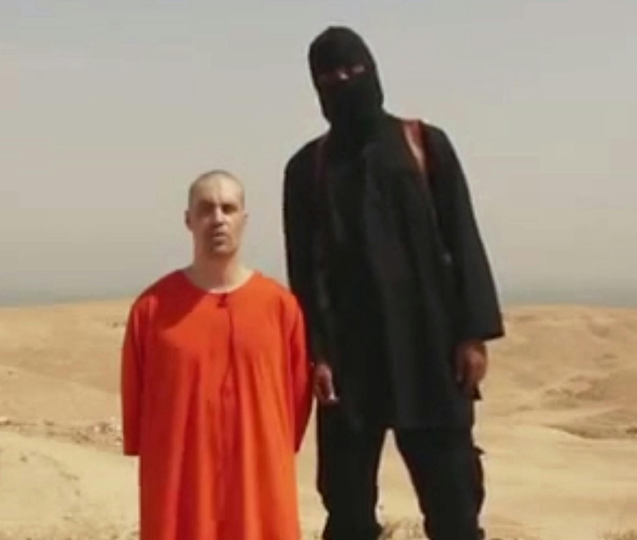 EDS NOTE: GRAPHIC CONTENT - This undated image shows a frame from a video released by Islamic State militants Tuesday, Aug. 19, 2014, that purports to show the killing of journalist James Foley by the militant group. Foley, from Rochester, N.H., went missing in 2012 in northern Syria while on assignment for Agence France-Press and the Boston-based media company GlobalPost. (AP Photo) ONLINE OUT ORG XMIT: MIN2014082117052462