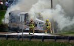 Maplewood firefighters doused a school bus engulfed in flames at the Century Ave. exit ramp on East bound 94, in May 2014.