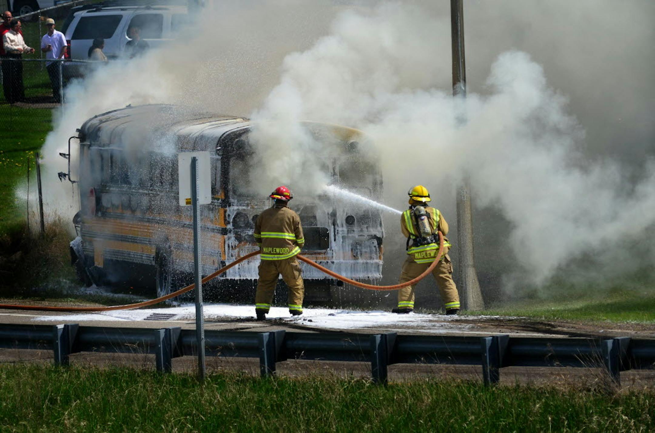 Maplewood firefighters doused a school bus engulfed in flames at the Century Ave. exit ramp on East bound 94, in May 2014.