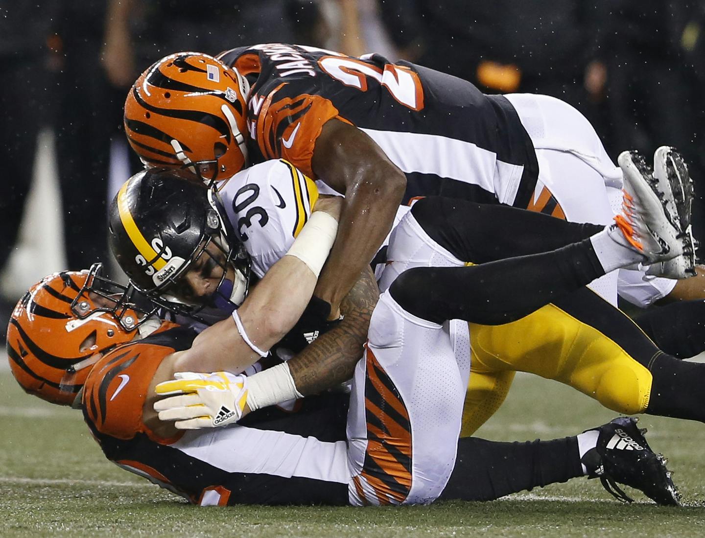 Pittsburgh Steelers running back James Conner (30) is tackled by Cincinnati Bengals cornerback William Jackson (22) in the second half of an NFL football game, Monday, Dec. 4, 2017, in Cincinnati. (AP Photo/Gary Landers)