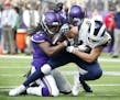 Vikings strong safety Anthony Harris, left, stripped the ball from Rams wide receiver Cooper Kupp near the goal line during the first half Sunday. Har