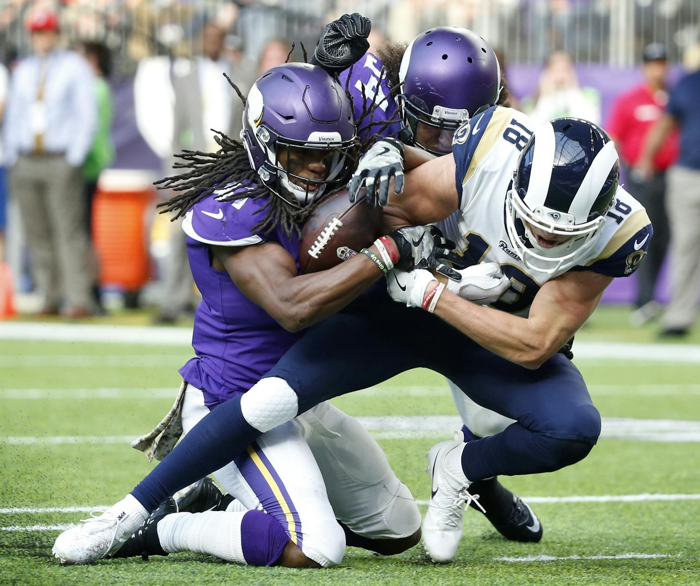 Vikings strong safety Anthony Harris, left, stripped the ball from Rams wide receiver Cooper Kupp near the goal line during the first half Sunday. Harris also recovered the fumble.