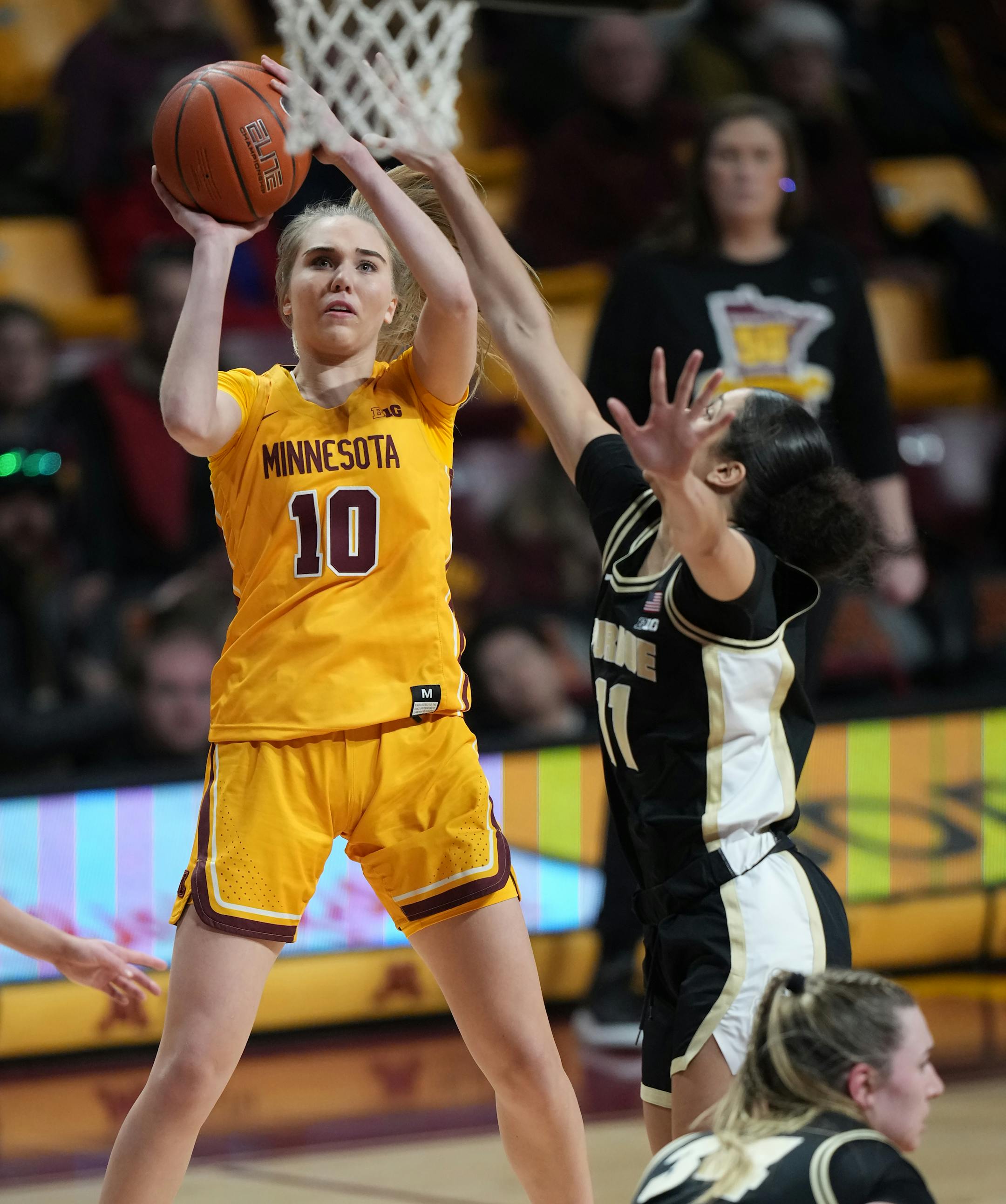Minnesota Gophers's Mara Braun (10) shoots against Purdue guard Lasha Petree (11).