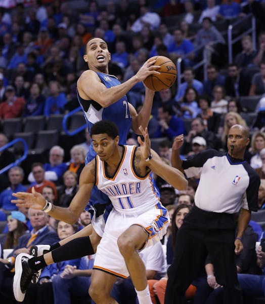 Minnesota Timberwolves guard Kevin Martin (23) is fouled by Oklahoma City Thunder guard Jeremy Lamb (11) in the first quarter of an NBA basketball gam