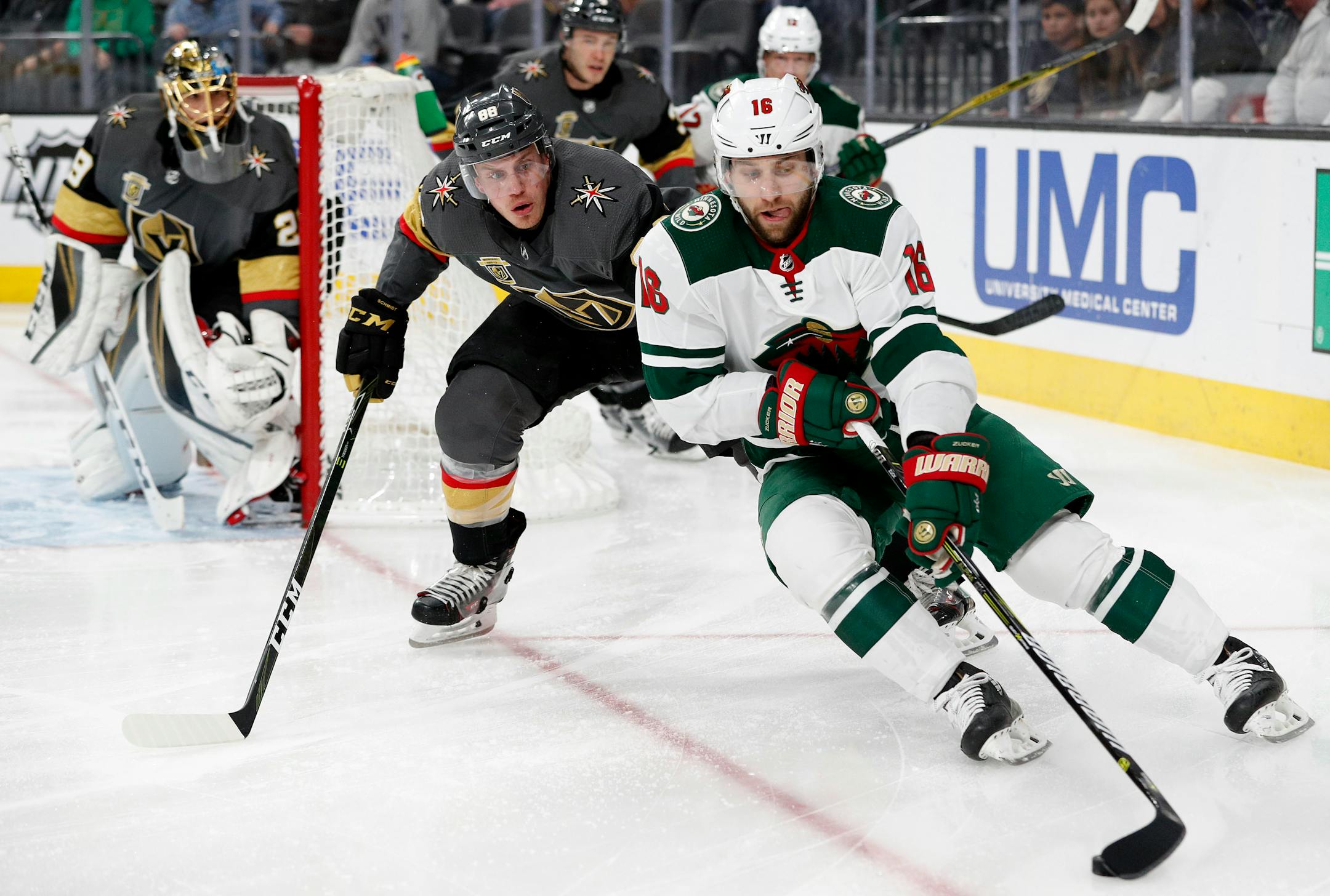 Wild left wing Jason Zucker skates around Vegas defenseman Nate Schmidt on Friday in Las Vegas.