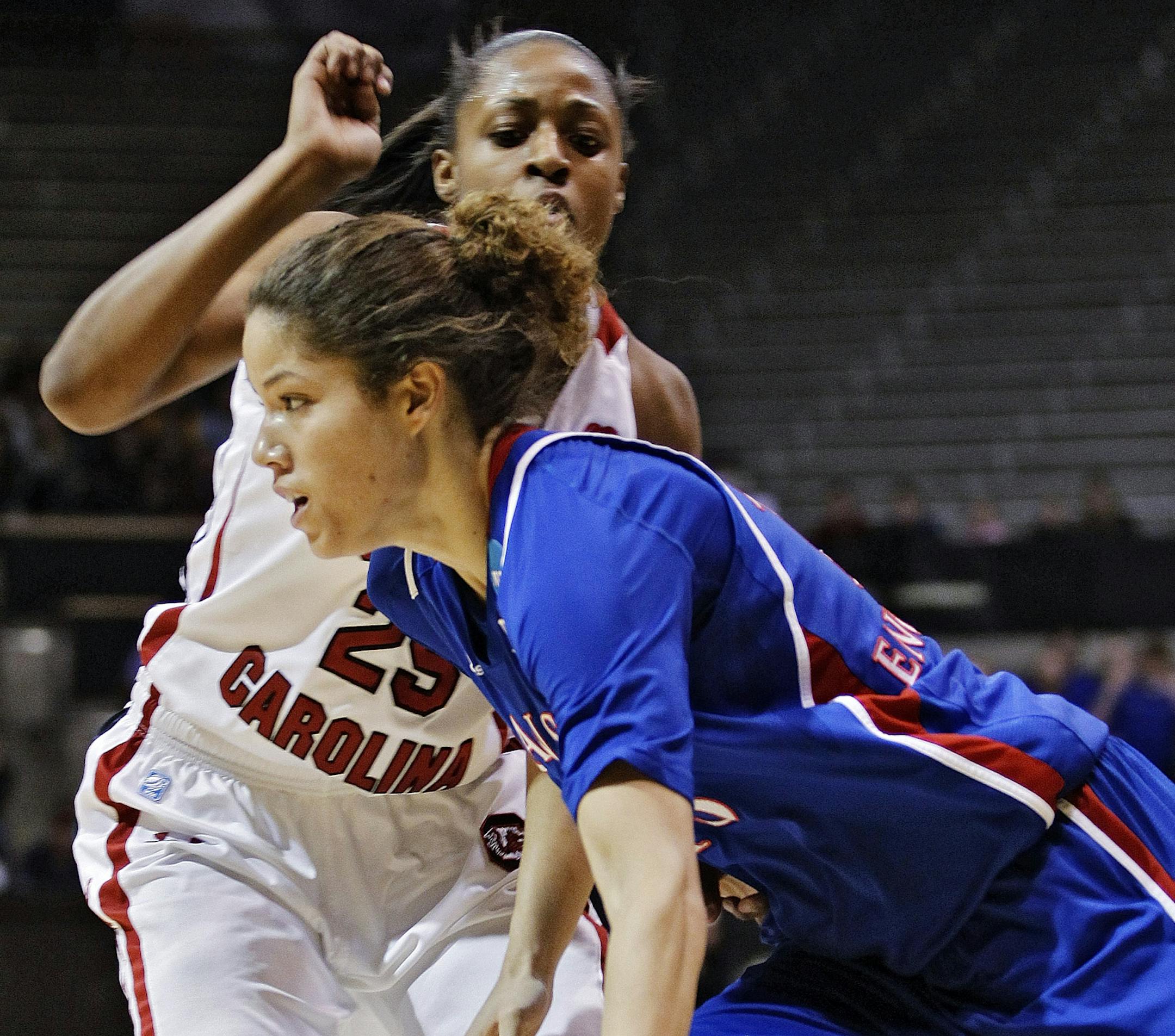 Kansas guard Monica Engelman (13) dribbles past South Carolina guard Tiffany Mitchell (25) during the first half of a second-round game in the women's NCAA college basketball tournament, Monday, March 25, 2013, in Boulder, Colo. (AP Photo/ Brennan Linsley )