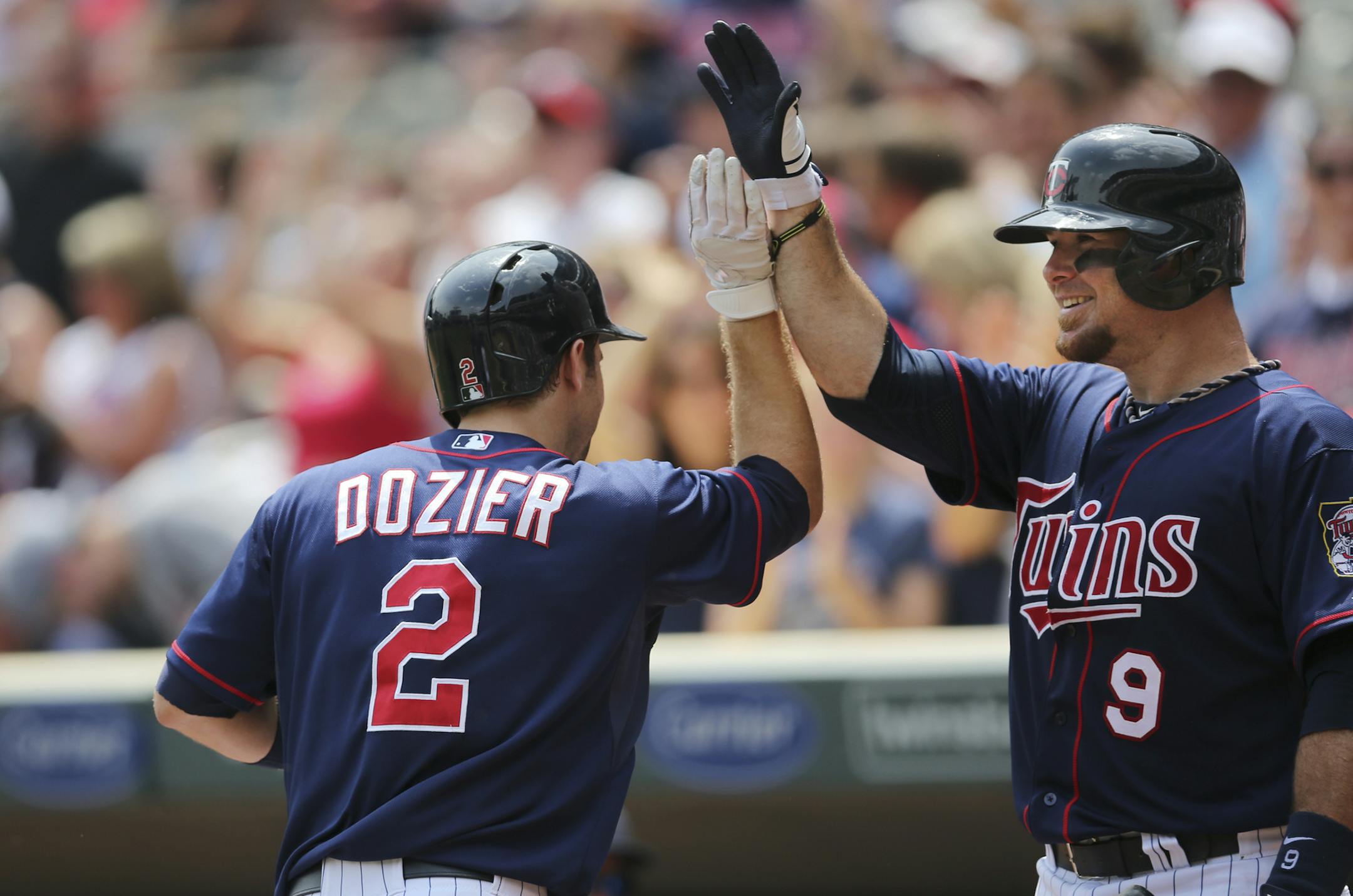 Brian Dozier, left, was greeted by Ryan Doumit after hitting another home run.