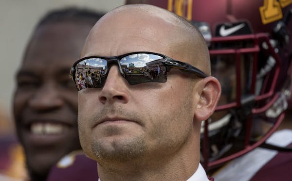 TCF Bank Stadium in reflected in P. J. Fleck's sunglasses as he took in the pre-game atmosphere before Minnesota took on Miami (Ohio), Saturday, Septe