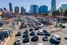 Commuters wait to drive through the Holland Tunnel into New York City during morning rush hour traffic in Jersey City, N.J.,, Wednesday, March 8, 2023