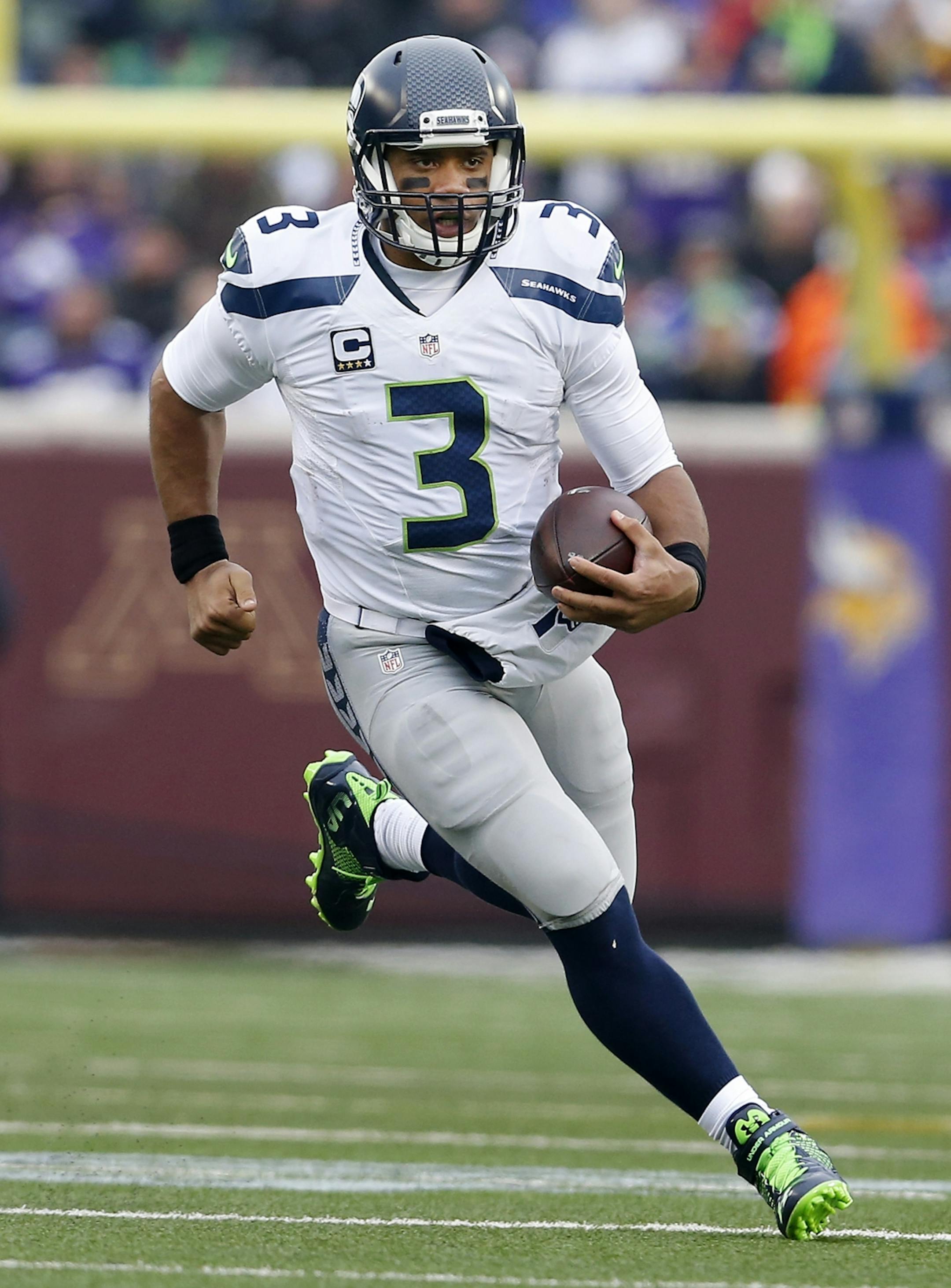 Seattle quarterback Russell Wilson (3) during a run in the third quarter