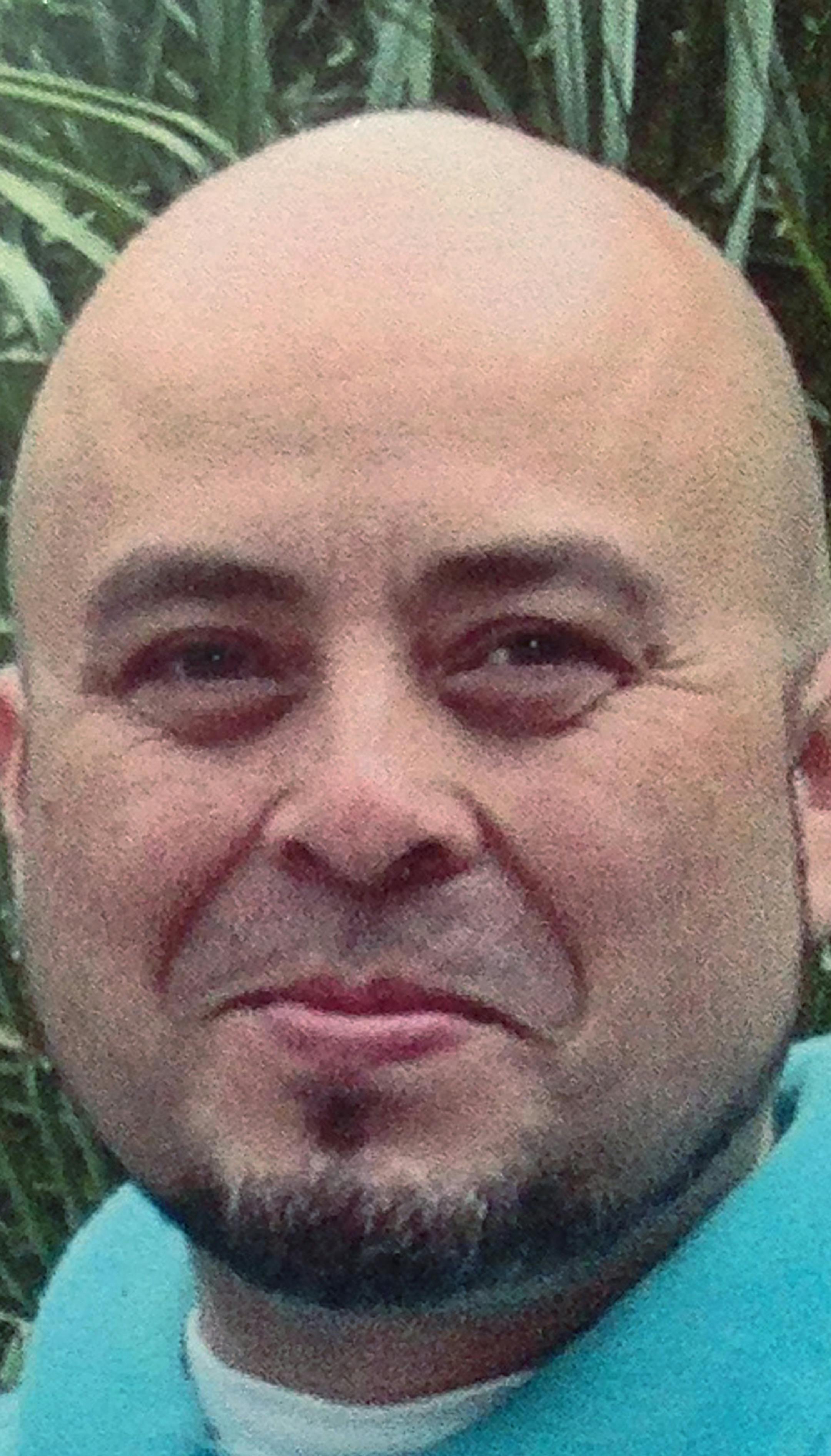 ALTERNATE HORIZONTAL CROP - This June, 2013 photo released by the Hernandez family Saturday, Nov. 2, 2013, shows Transportation Security Administration officer Gerardo Hernandez. Hernandez, 39, was shot to death and several others wounded by a gunman who went on a shooting rampage in Terminal 3 at Los Angeles International Airport Friday. (AP Photo/Courtesy Hernandez Family) ORG XMIT: MIN2013110217063553