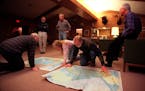 File photo from December, 1997: Folks looked over detailed maps of the Arctic region at Warner Nature Center near Marine on St. Croix.