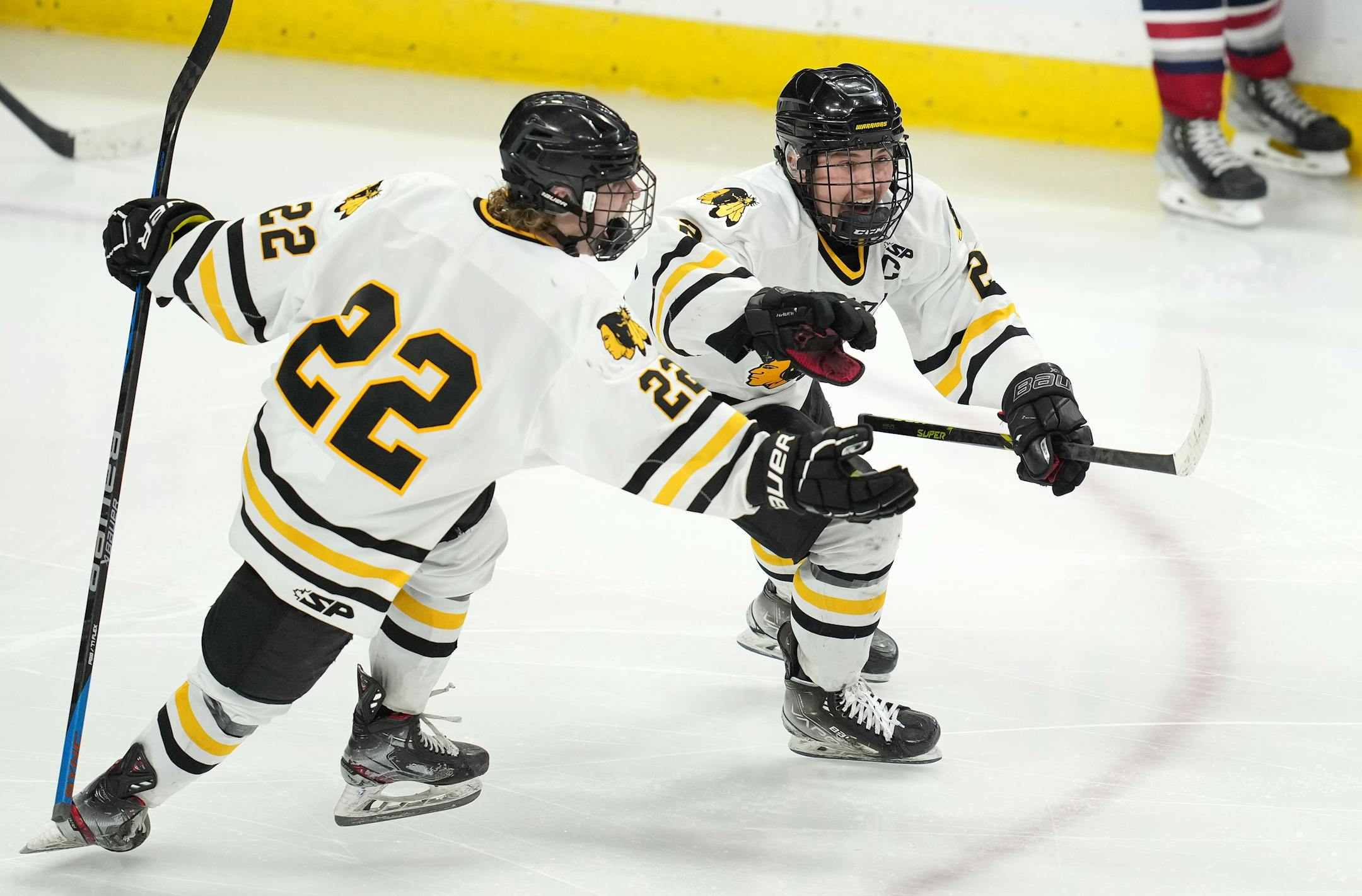 Warroad defenseman Erick Comstock (2) celebrates after scoring the game winning goal past Orono goaltender Brock Peyton (1) in the second period of overtime.
