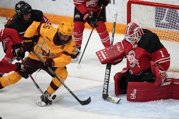 Gophers forward Ella Huber (26) battled in front of Ohio State's net when the teams met Jan. 13 at Ridder Arena.