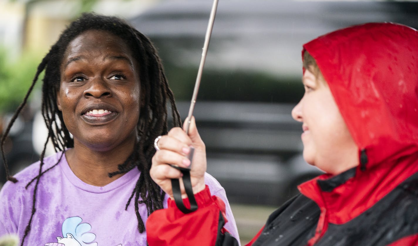 Yvette Cross, left, talks to Ramsey County Commissioner Trista MatasCastillo about pedestrian road safety. ] LEILA NAVIDI &#xa5; leila.navidi@startribune.com BACKGROUND INFORMATION: Ramsey County Commissioner Trista MatasCastillo talks to St. Paul resident Yvette Cross about pedestrian road safety during a community event in St. Paul Tuesday, June 4, 2019. The official Stop For Me event was cancelled due to thunderstorms.