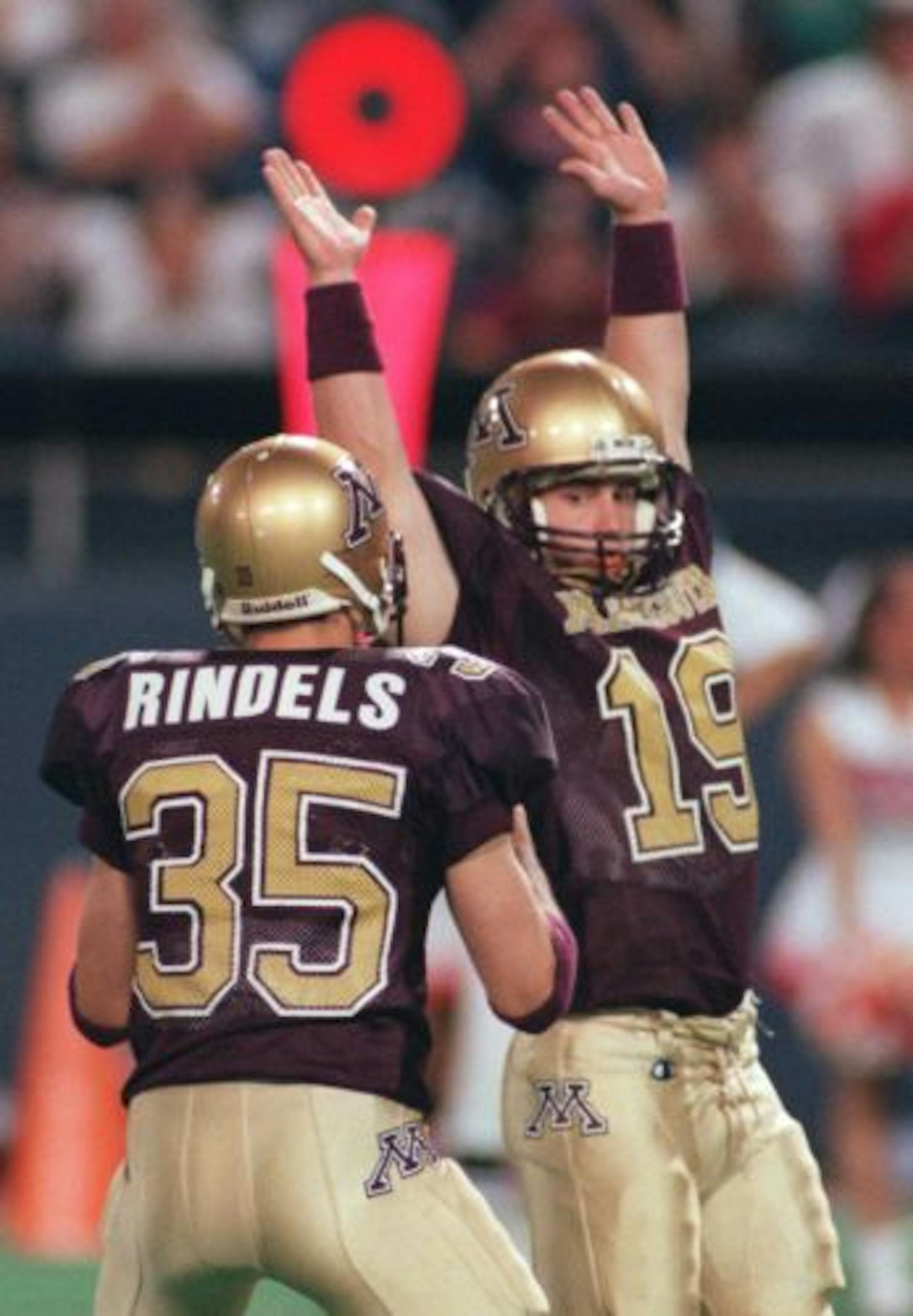 -- Kicker Adam Bailey signals that his kick his good to holder Ryan Rindels after he put the Gophers ahead 35-33.