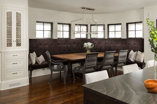 A built-in banquette in the kitchen takes the place of a formal dining room in this home, one of 57 featured on the Remodelers Showcase. It’s #R39.
