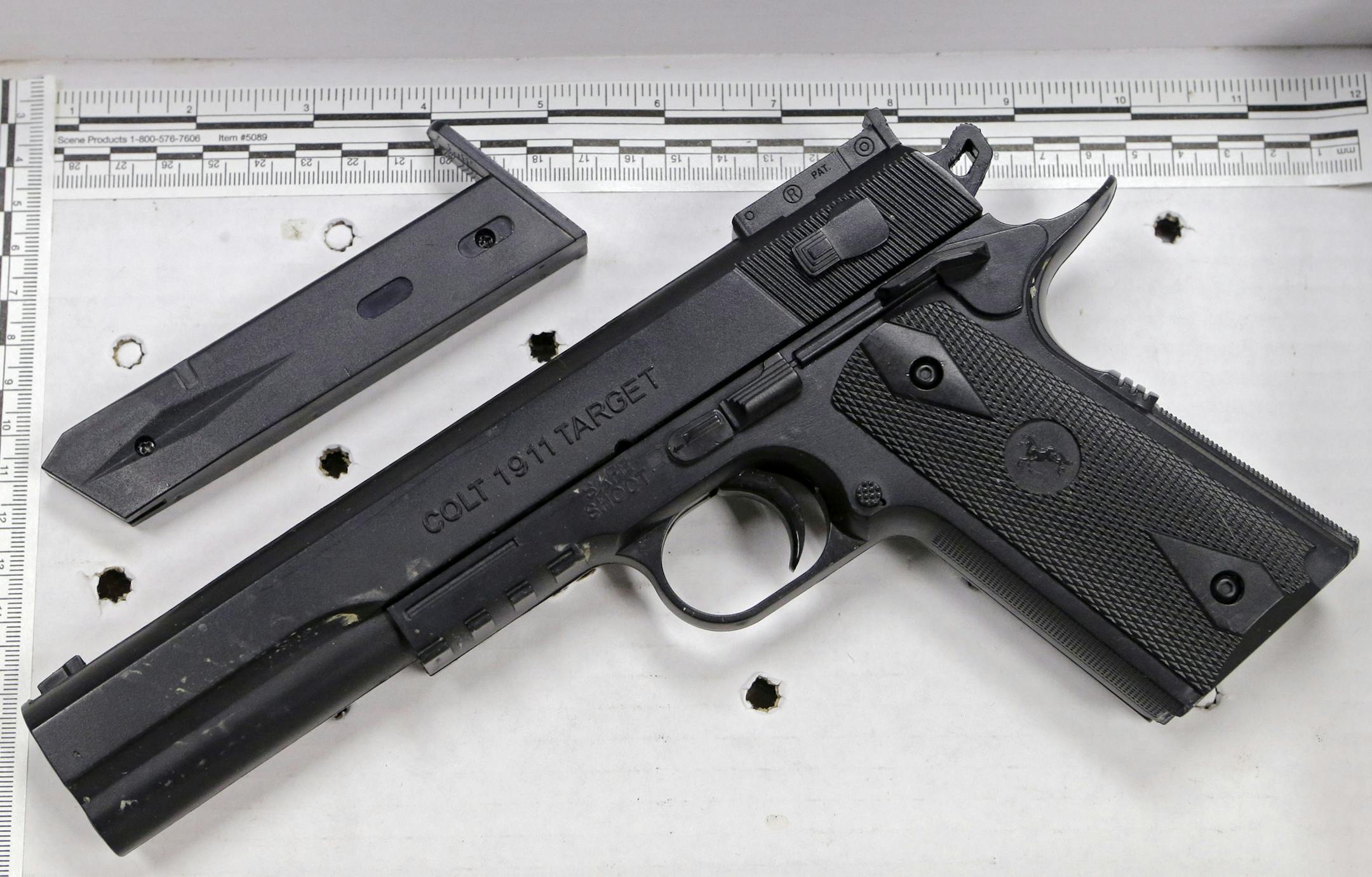 FILE- In a Wednesday, Nov. 26, 2014 file photo, a fake handgun taken from 12-year-old Tamir Rice, who was fatally shot by Cleveland police, is displayed after a news conference in Cleveland. The 12-year-old was shot at a city park after he reportedly pulled the Colt 1911 replica on arriving officers. Two fatal police shootings in less than four months of young people holding lookalike guns in Ohio have raised calls for action to prevent such tragedies. (AP Photo/Mark Duncan, File)