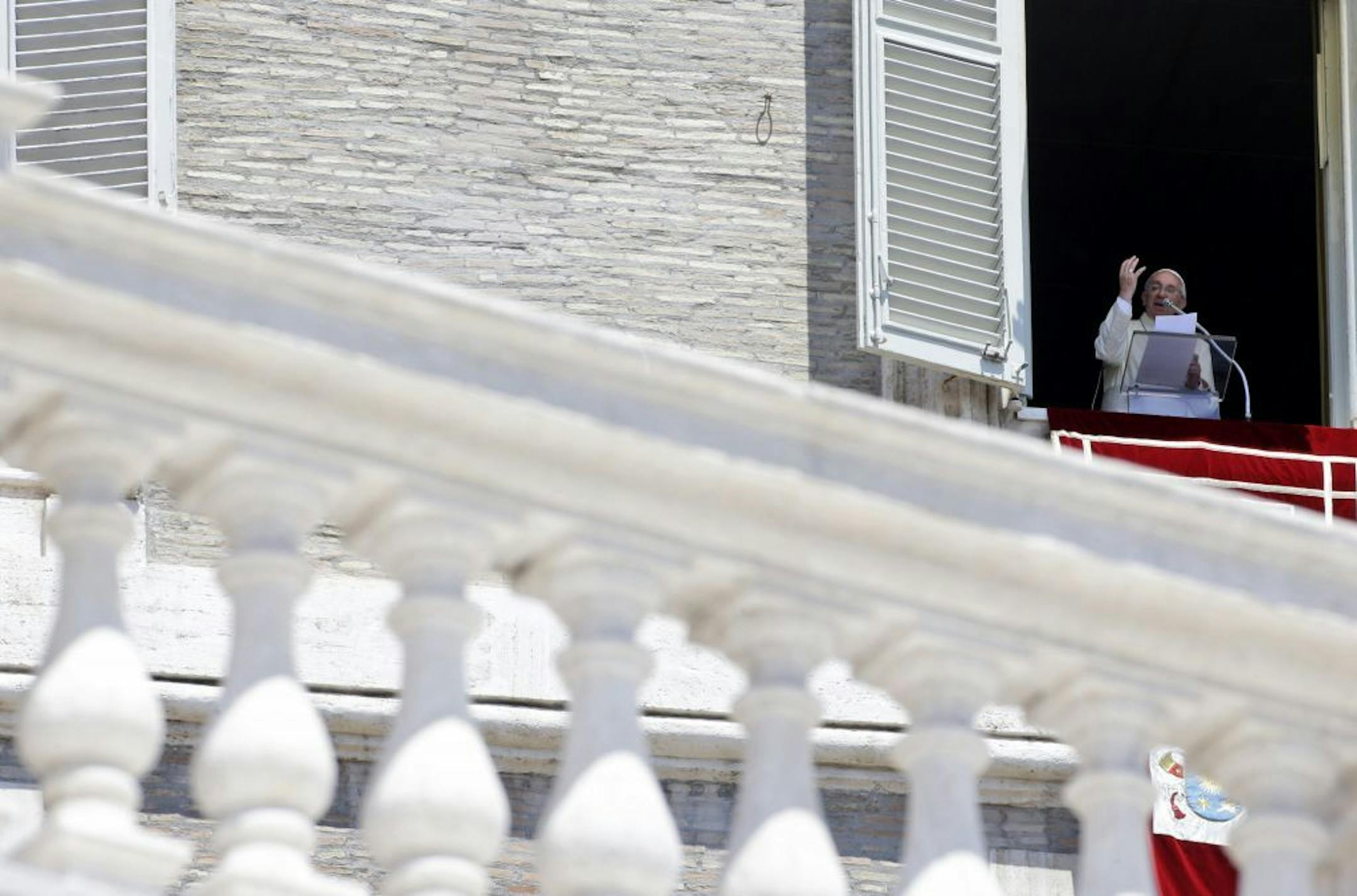 Pope Francis delivers the Angelus prayer from his studio's window, overlooking St. Peter's Square at the Vatican, Sunday, June 30, 2013. The Pontiff says his predecessor, Benedict XVI, was courageously following his conscience when he decided to retire. Benedict became the first pontiff in 600 years to quit the post when he resigned in February, paving the way for Francis' election as Pope two weeks later. Francis told pilgrims and tourists in St. Peter's Square on Sunday that God made Benedict