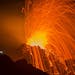 A person looks at the Piton de la Fournaise volcano in eruption Thursday, Feb. 5, 2015, in the French Indian Ocean island of La Reunion. This is the s