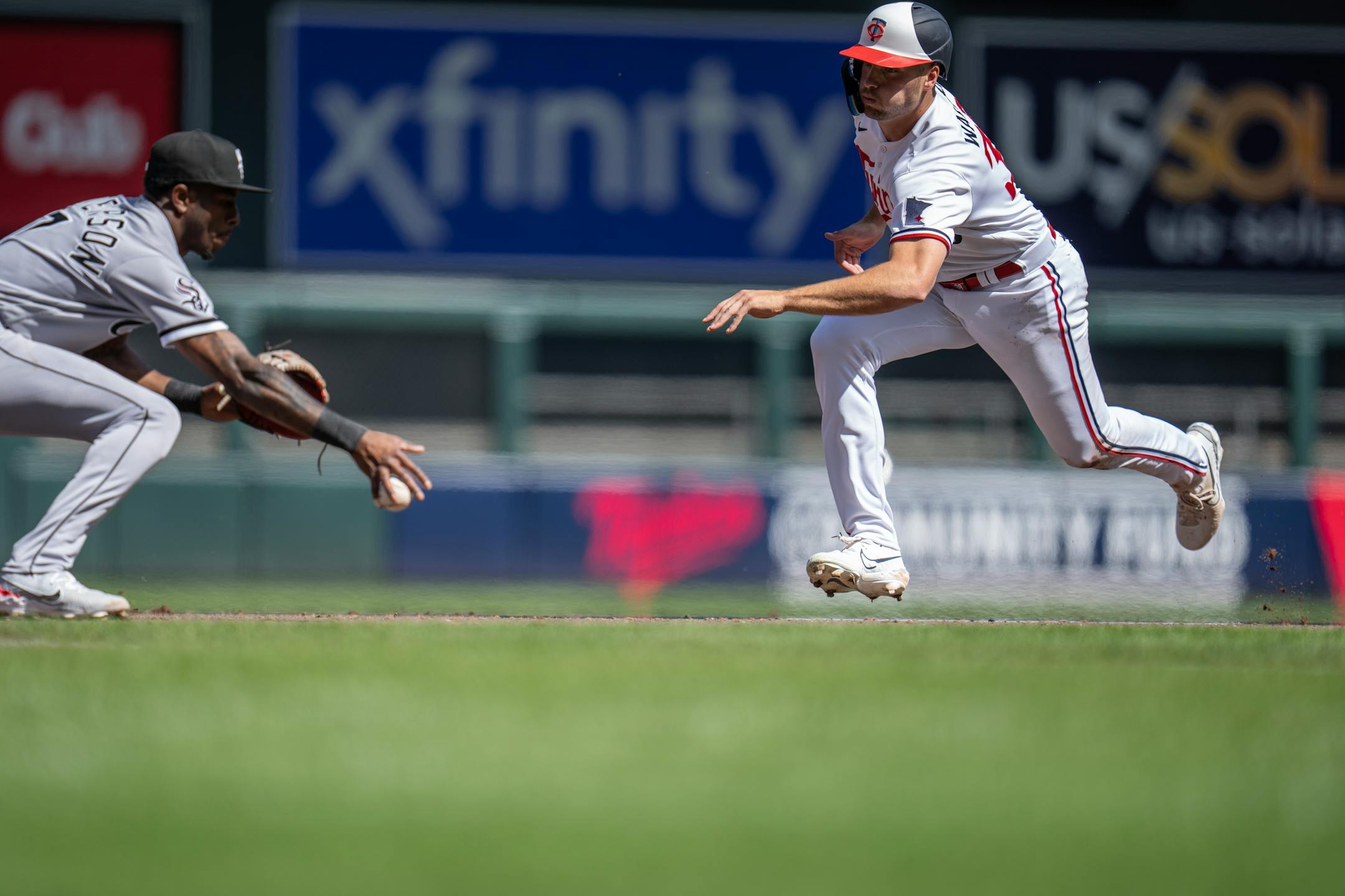 Twins right fielder Matt Wallner was safe a third after he collided with Chicago White Sox shortstop Tim Anderson (7), left, during a rundown in the fourth inning.
