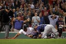 He's out! Jason Castro tagged the Red Sox's Rafael Devers at home in the ninth inning, preserving the Twins' 2-1 victory and a series win at Fenway Pa