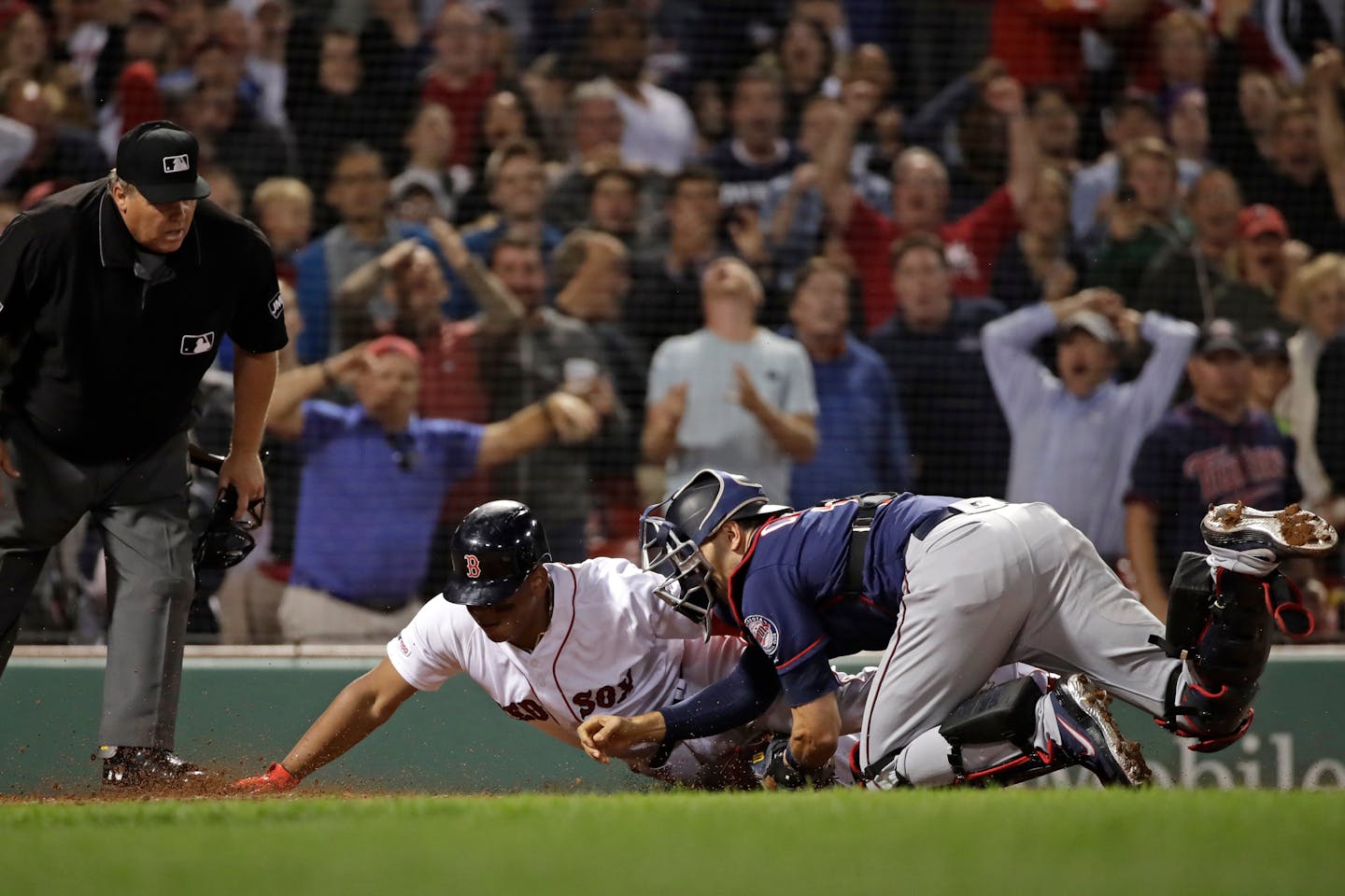 He's out! Jason Castro tagged the Red Sox's Rafael Devers at home in the ninth inning, preserving the Twins' 2-1 victory and a series win at Fenway Park.