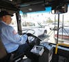 MTS bus driver Tom Middleton, 66, who had a career as a software engineer, waits at traffic light on Clairemont Mesa Boulevard in San Diego while driv