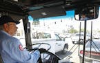 MTS bus driver Tom Middleton, 66, who had a career as a software engineer, waits at traffic light on Clairemont Mesa Boulevard in San Diego while driv