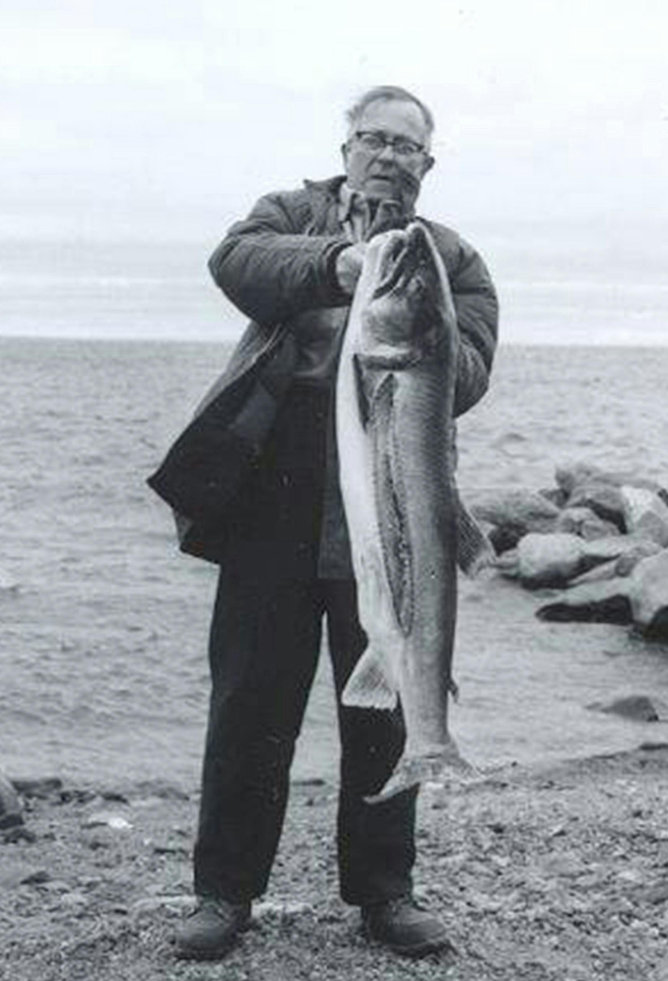George Herter around 1980 on the shores of Lake Superior, with a lake trout. Photo courtsey Waseca Historical Society