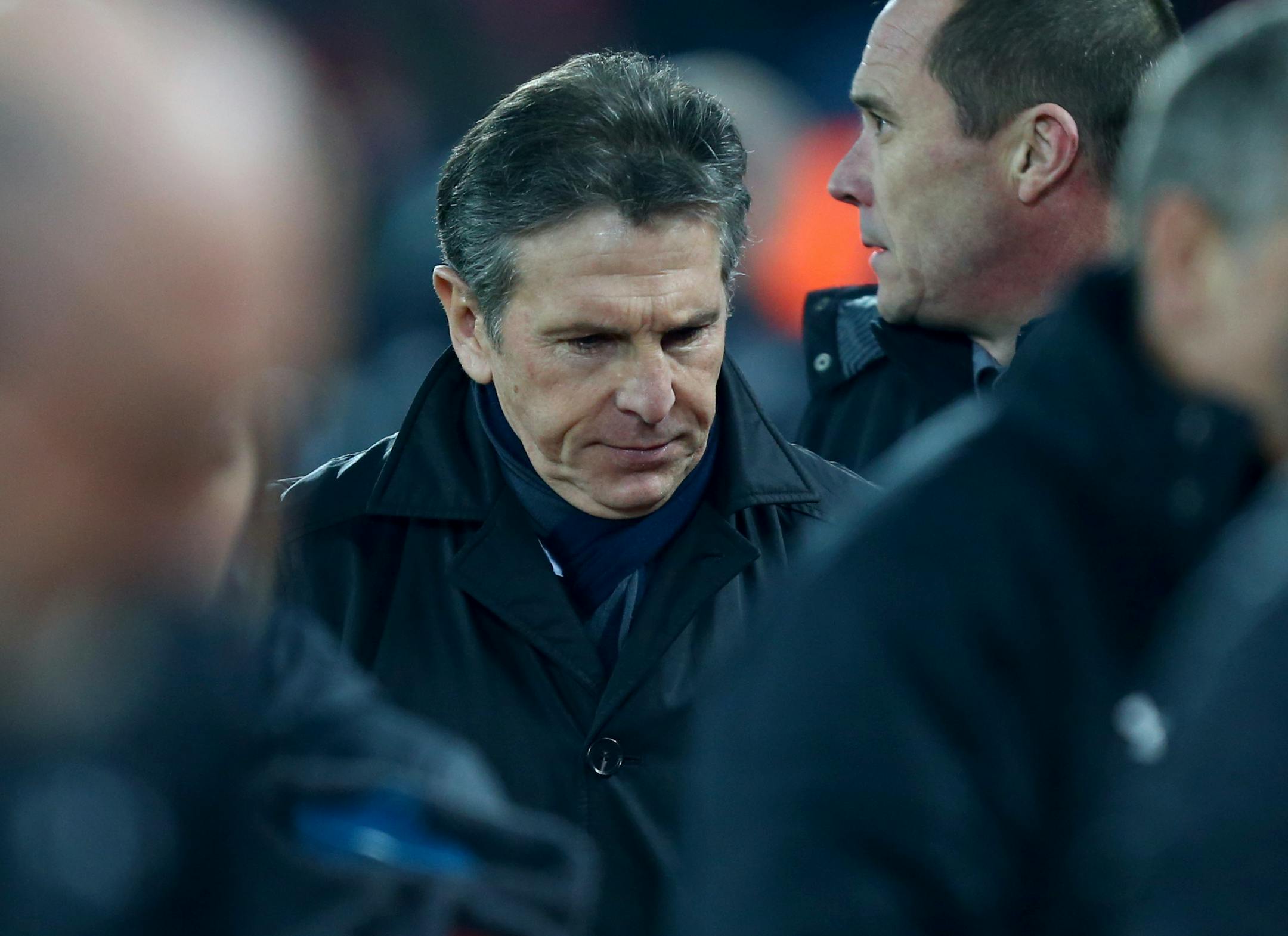 Southampton's manager Claude Puel, left, walks to take his seat before the English League Cup semifinal 2nd leg soccer match between Liverpool and Southampton at Anfield stadium in Liverpool, England, Wednesday, Jan. 25, 2017. (AP Photo/Dave Thompson)