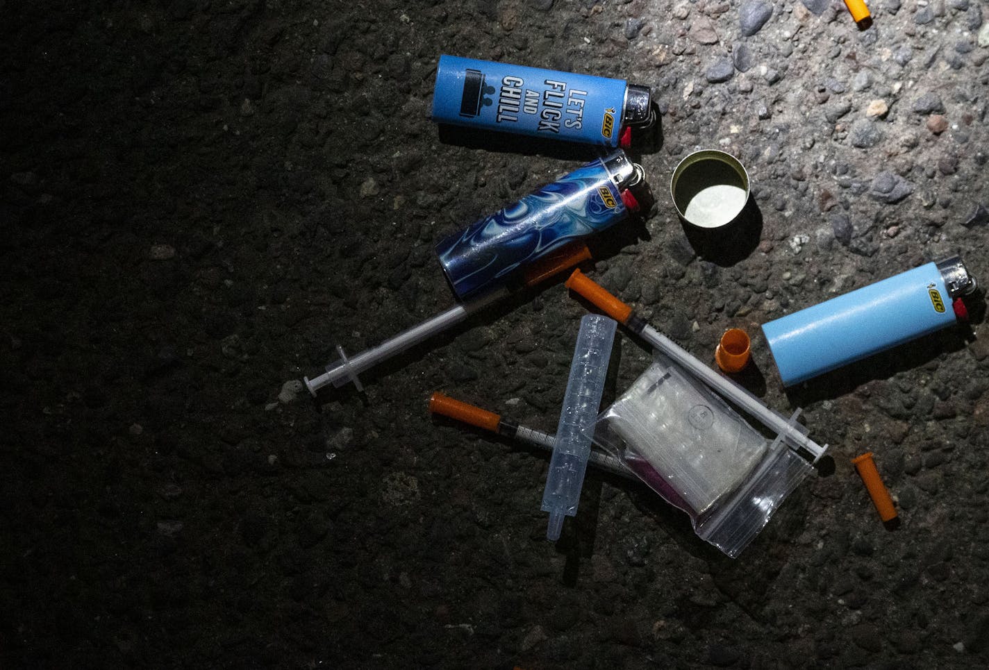 A collection of needles and lighters sat on the street next to a vehicle suspected of having drugs inside. A few grams of heroine were found in the passenger seat.]
ALEX KORMANN &#x2022; alex.kormann@startribune.com In recent years there has been a large increase in meth, heroine and opioids flowing into Duluth, MN in recent years. The Duluth Police Department and St. Louis Sheriff's Department has worked in tandem with the DEA to clean up the streets and stop the flow of drugs as much as possib