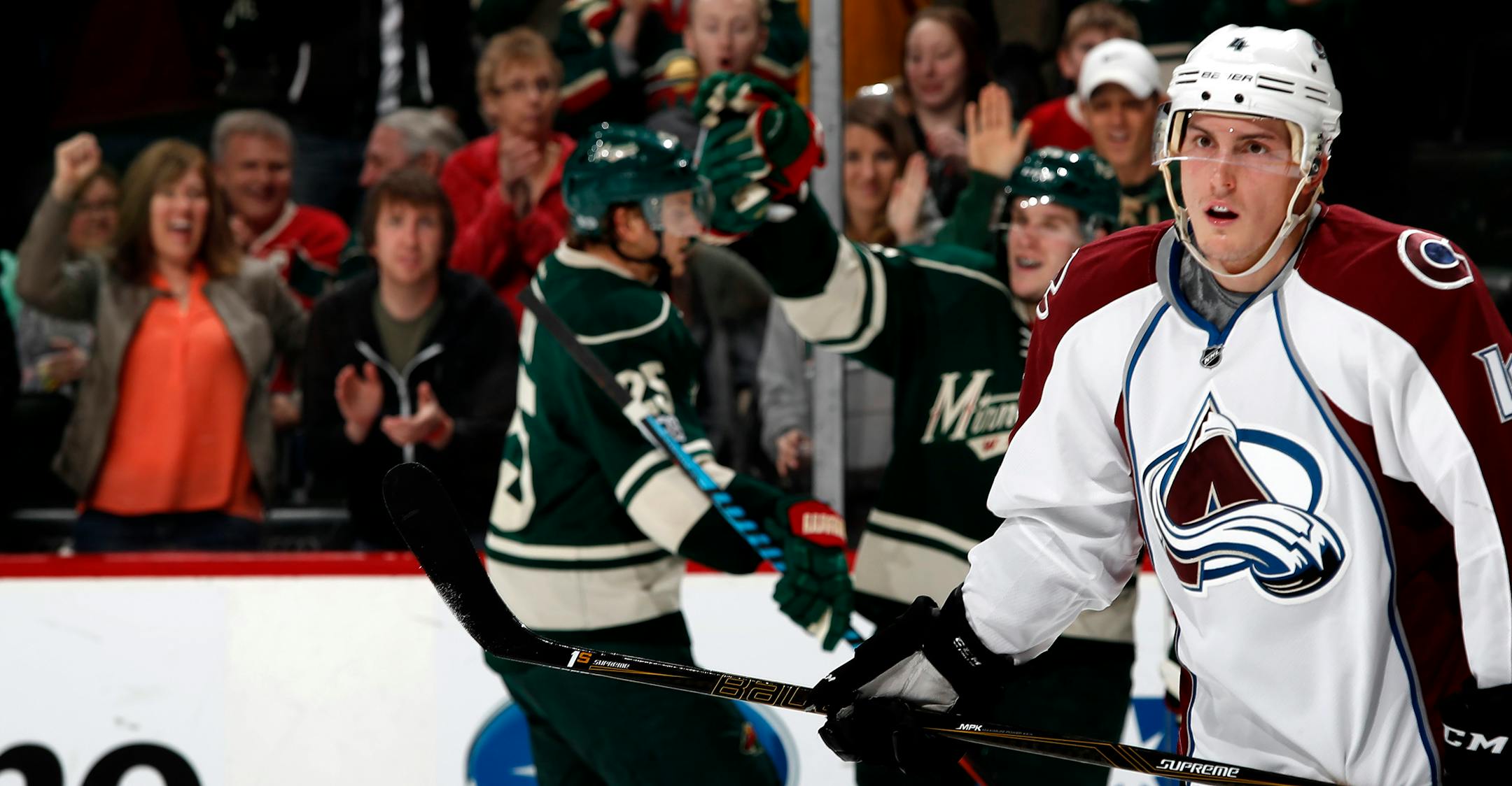 The Avalanche's Tyson Barrie skated away as the Wild's Erik Haula, center, celebrated with Jonas Brodin after Haula scored a first-period goal Sunday at Xcel Energy Center.
