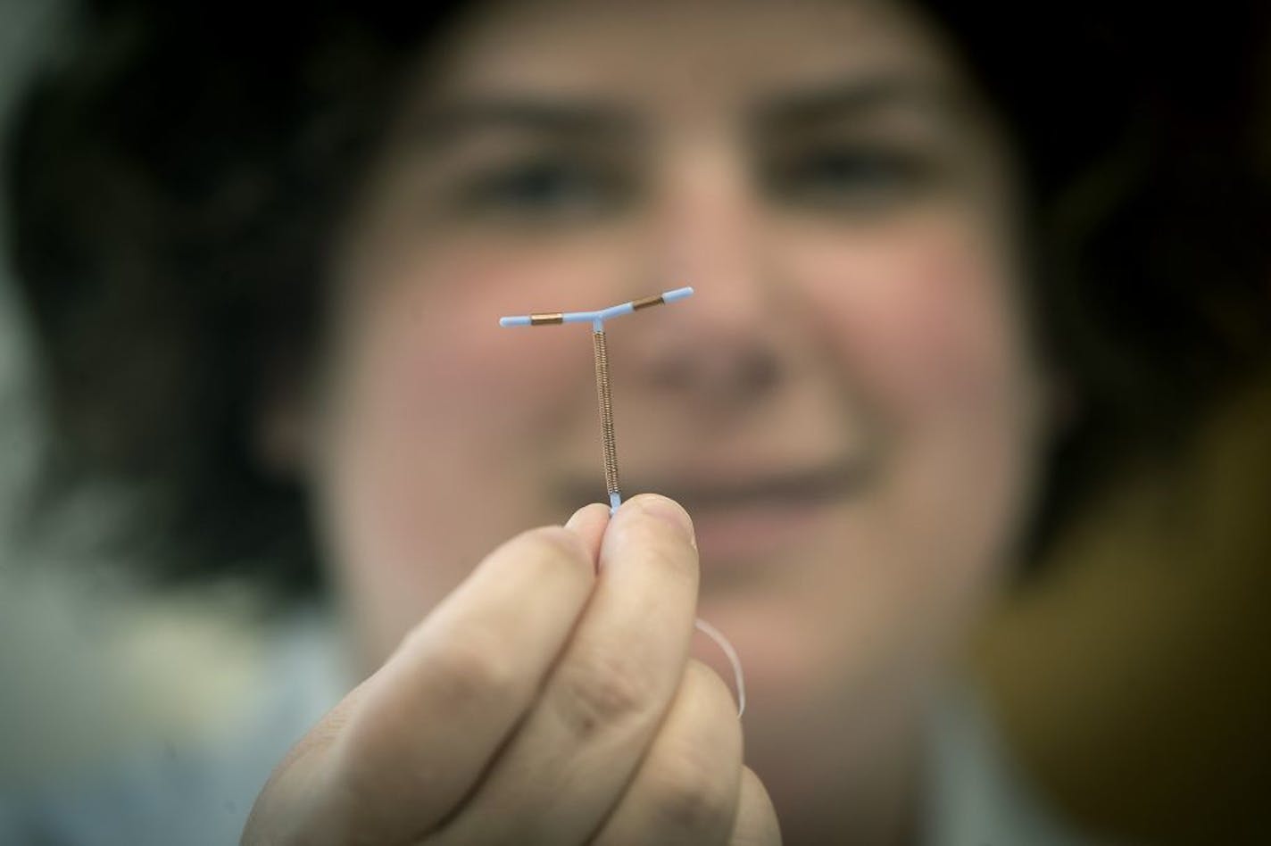 Nurse Practitioner Jessica Zaldivar held up a type of IUD that is commonly used at a Planned Parenthood facility, Thursday, May 4, 2017 in Minneapolis, MN.