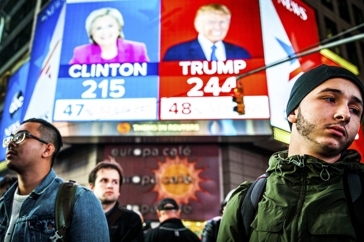 FILE-- People watch election results at Times Square in New York, Nov. 9, 2016. Clinton has followed Al Gore as the second Democratic presidential candidate in modern history to be defeated by a Republican who earned fewer votes, in his case by George W. Bush. Even President-elect Donald Trump, who won the electoral vote but lost the popular vote, called the system "a disaster for a democracy" in 2012. (George Etheredge/The New York Times)