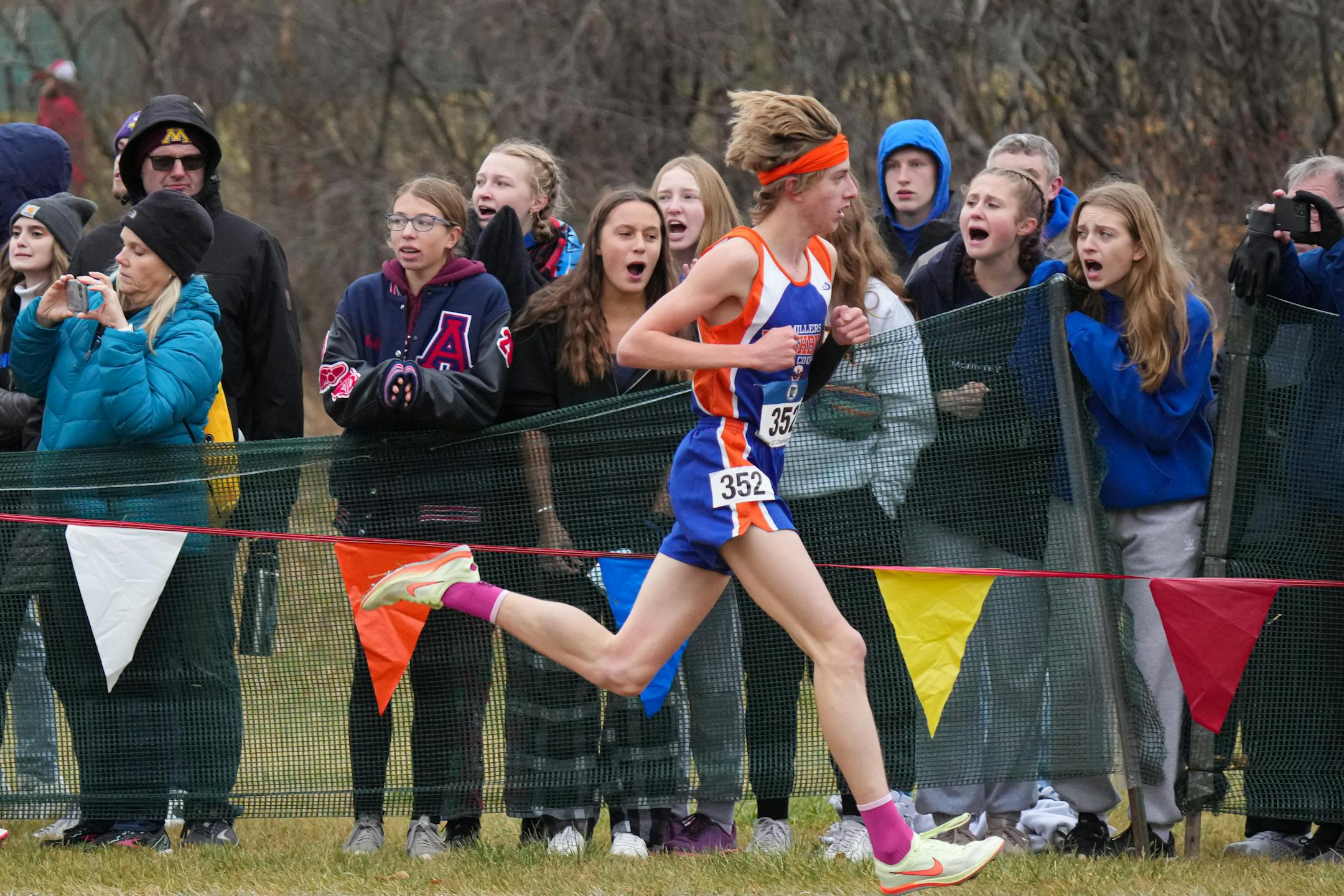 Aiden Jones leads midway through the boys 3A cross country race.