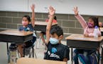 Masked first-grade students in a summer school program at Vista View Elementary School in Burnsville. 