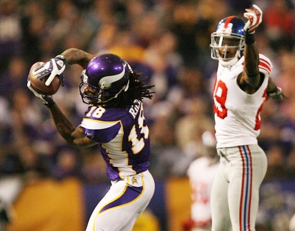Vikings receiver Sidney Rice pulled down a second catch over Giants D.J. Johnson.