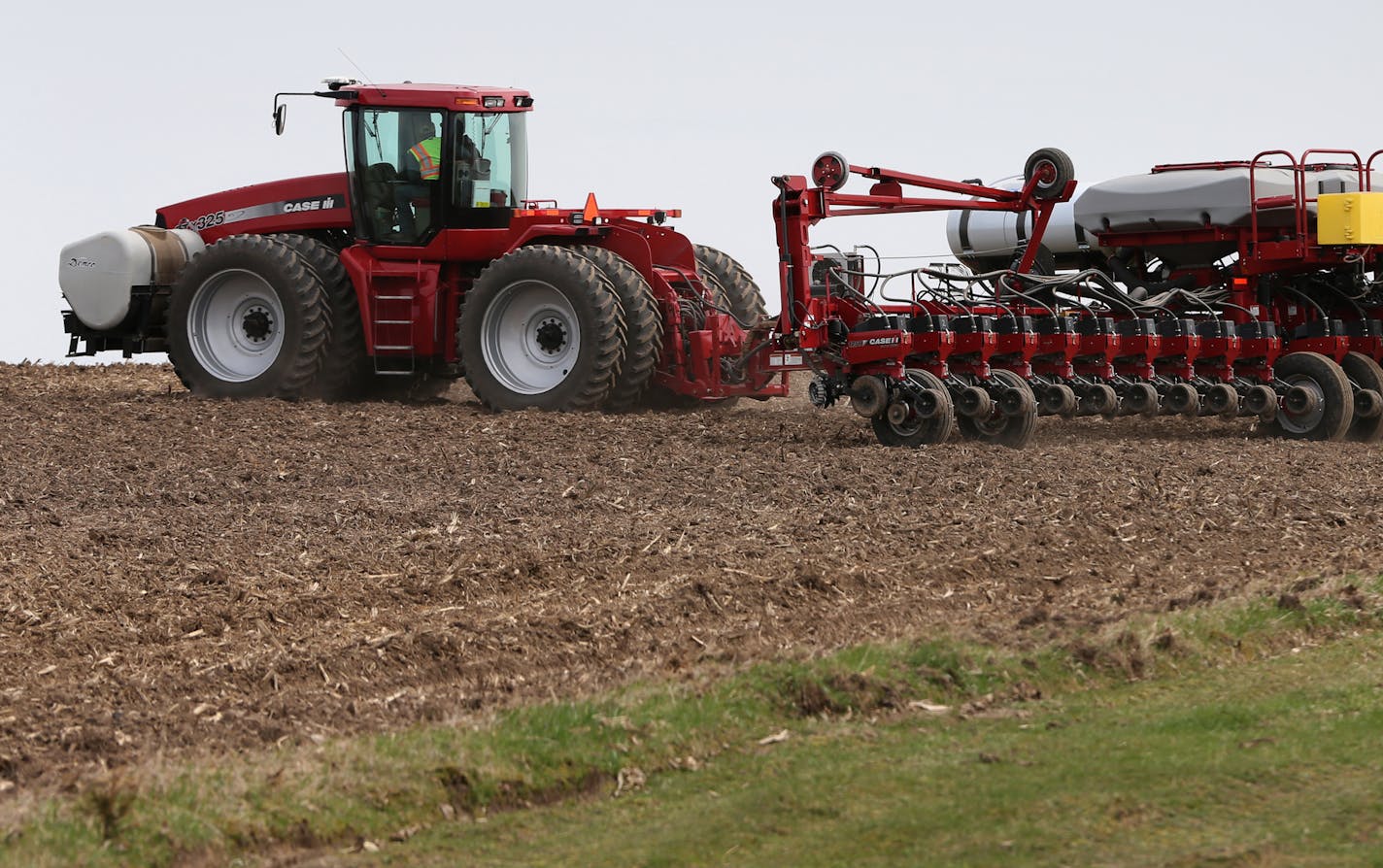 Farmer Craig Breuer planted corn on fields near Marty Amundsen's Zumbrota MN. farm on 5/6/14, using GPS to guide both the tractor and where the planter put corn seeds into the fields. Amundsen was planting on leased land. Precision agriculture, in which new technology wastes fewer seeds and less fertilizer is transforming the way crops are produced. Many farmers have already adopted GPS-aided equipment, which pin-points were the tractors are in the field and where seeds are planted, but more imp