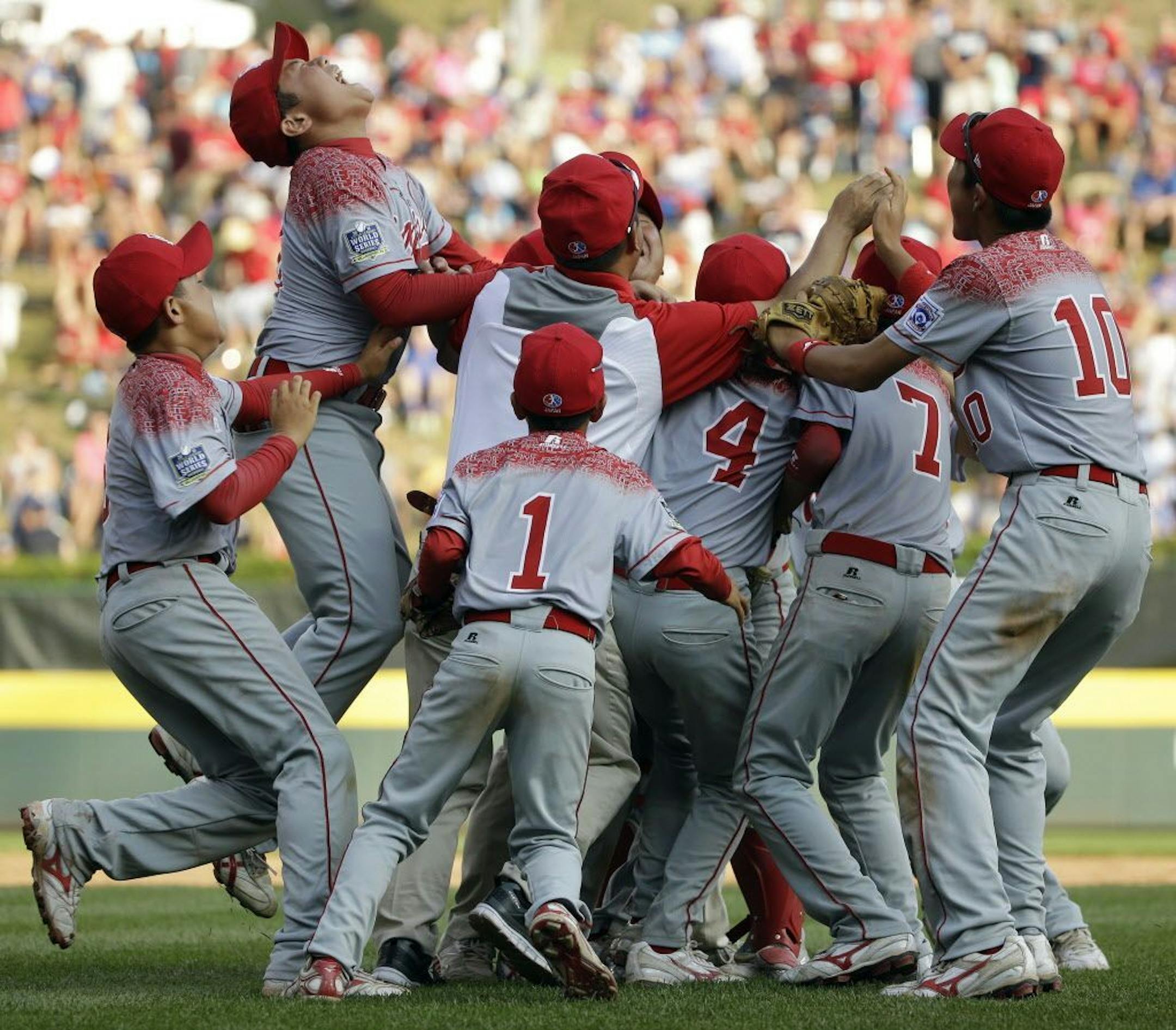 Japan celebrates after winning the Little League World Series Championship baseball game against Lewisberry, Pa., Sunday, Aug. 30, 2015, in South Williamsport, Pa. Japan won 18-11.