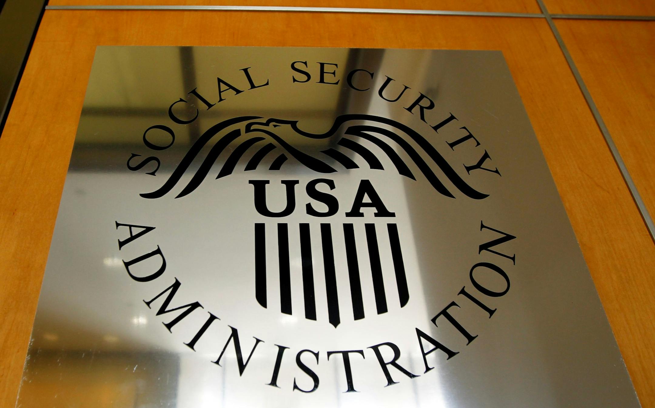 A sign for the Social Security Administration is seen in Los Angeles, Friday, July 29, 2011. If the debt ceiling currently being debated in Congress does not rise, the government would need to choose what to pay and what not, including benefits like Social Security. (AP Photo/Matt Sayles) ORG XMIT: CAMW102