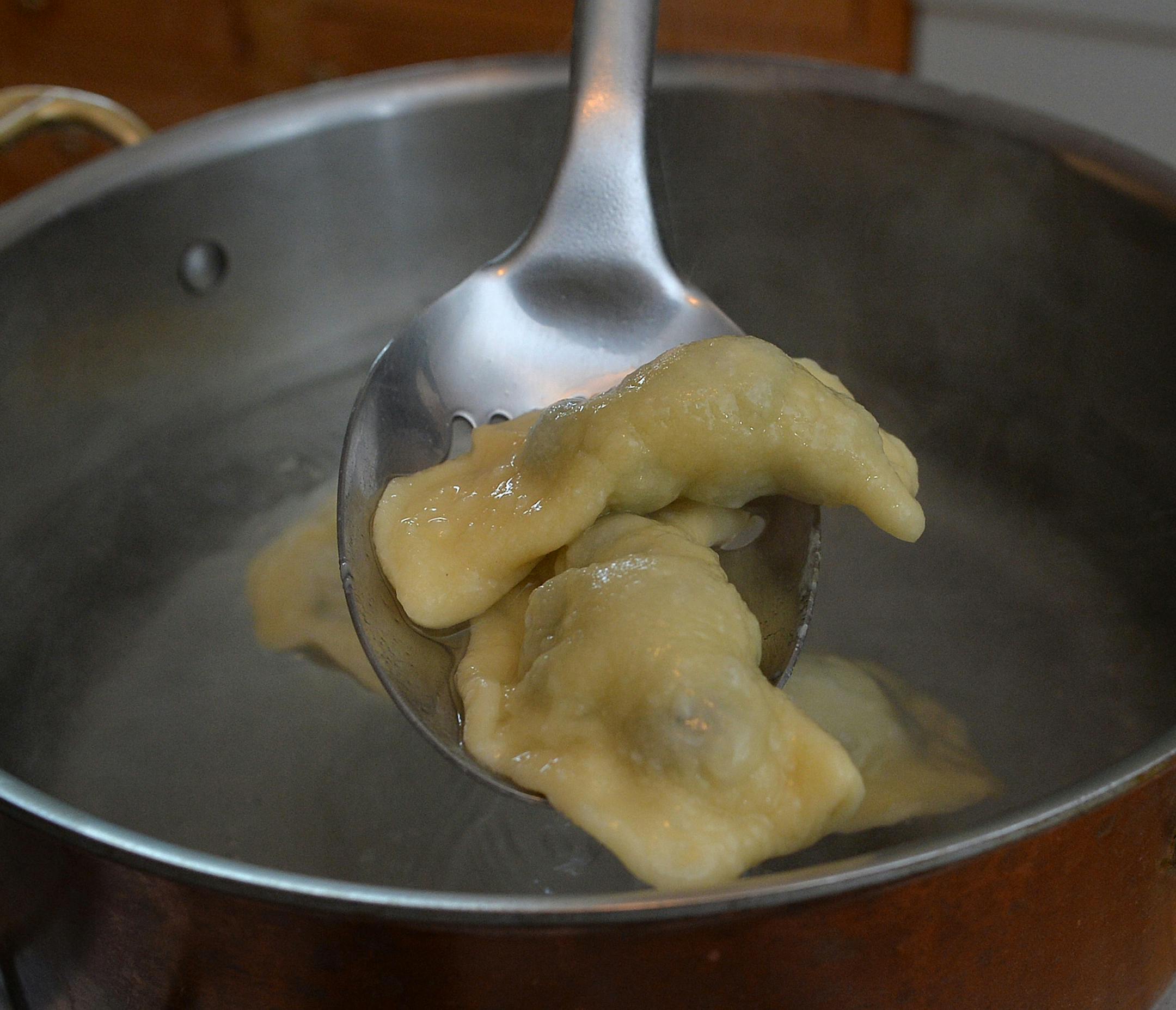 Spoon the pierogies out of the boiling water to drain before saut&#x221a;&#xa9;ing. ] (SPECIAL TO THE STAR TRIBUNE/BRE McGEE)