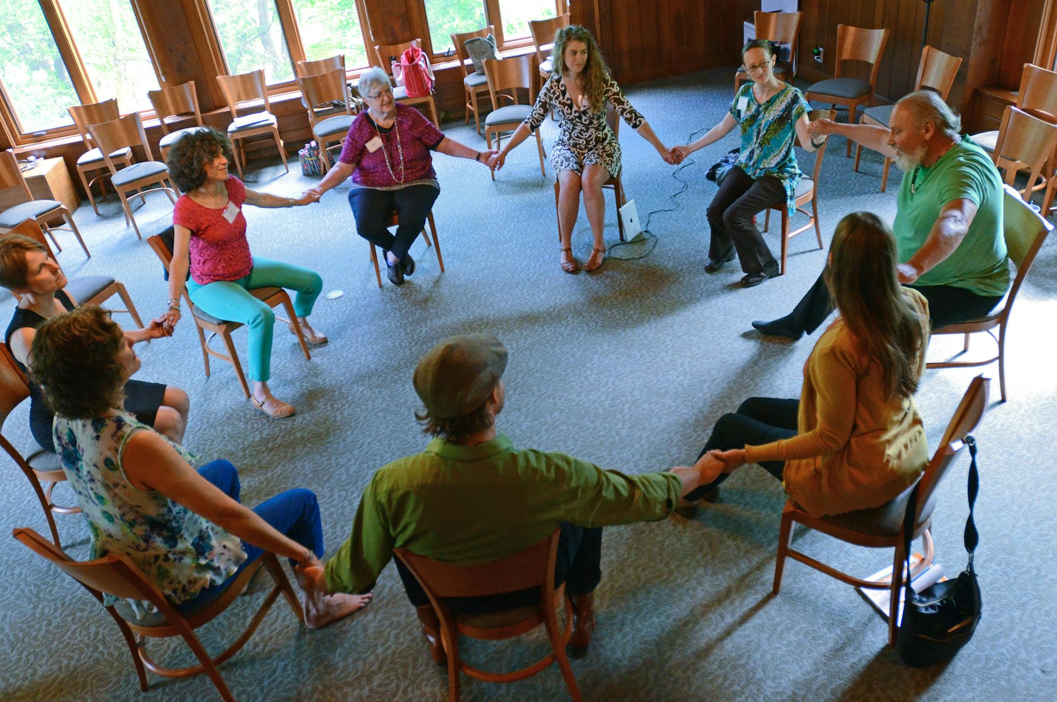 Kairos Alive! staff members and conference participants held hands during an interactive workshop featuring movement, storytelling and song at the Midwest Arts & Aging Conference & Showcase.] Joey McLeister,Special to the Star Tribune,Chaska,MN June 19,2015