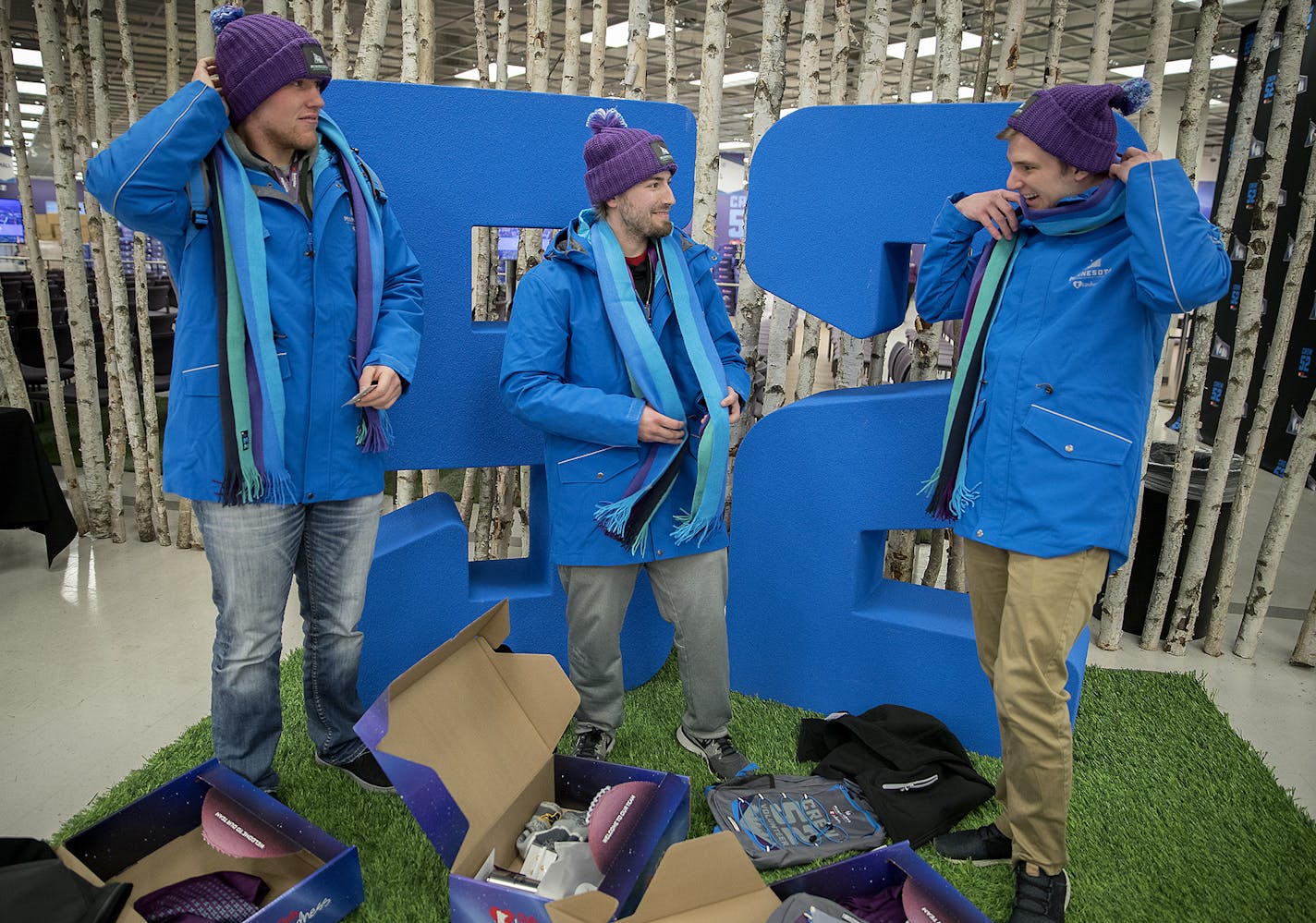 Justin White,Colby Vlieger and Jonny Solma were among the Super Bowl volunteers checking out their winter wear last week in downtown Minneapolis. Uniforms consist of a long-sleeve polo, fleece, lightweight puffer, wind-resistant shell jacket, a scarf, socks, stocking cap and "Bold North" mittens.